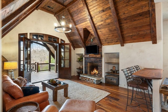 living room with built in features, wooden ceiling, beam ceiling, and hardwood / wood-style floors