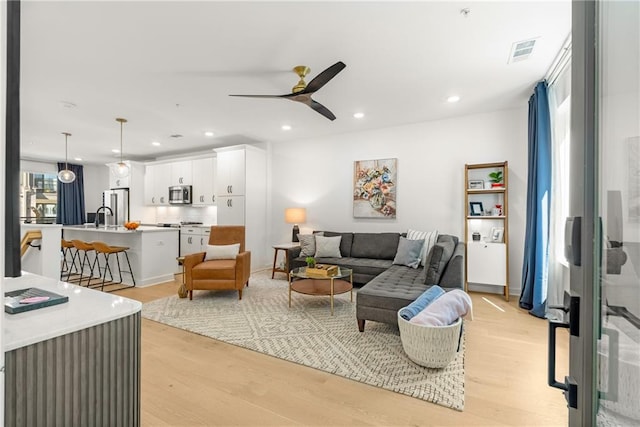 383 Pratt Dr SE Unit 503, Atlanta, GA 30315 - living room with light wood-type flooring, ceiling fan, and recessed lighting