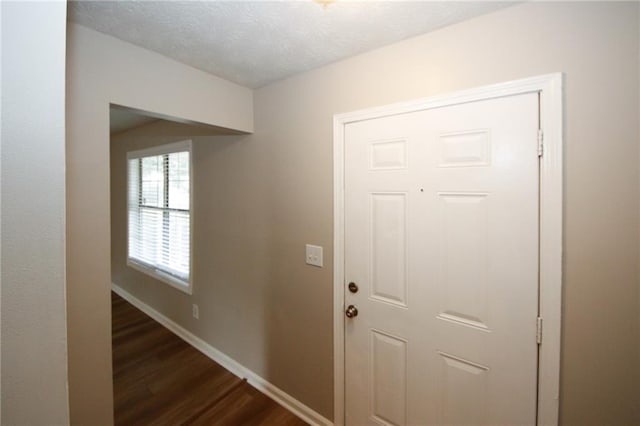 unfurnished room featuring hardwood / wood-style flooring and a notable chandelier