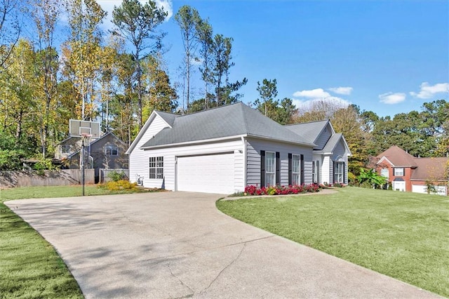 view of front of property featuring a garage and a front lawn