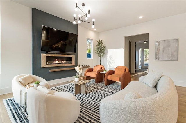 1045 Shepherds Ln NE, Atlanta, GA 30324 - living area featuring a notable chandelier, wood finished floors, recessed lighting, a fireplace, and baseboards