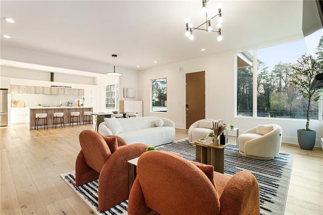 1045 Shepherds Ln NE, Atlanta, GA 30324 - living area featuring a notable chandelier, recessed lighting, baseboards, and light wood finished floors