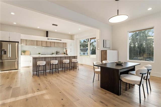 1045 Shepherds Ln NE, Atlanta, GA 30324 - dining area with recessed lighting, plenty of natural light, and light wood-style flooring