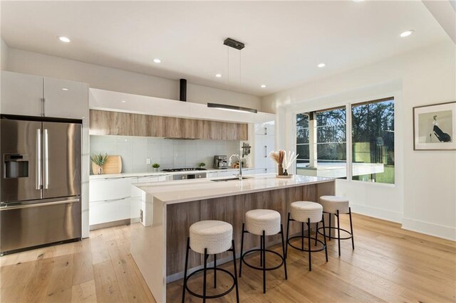 1045 Shepherds Ln NE, Atlanta, GA 30324 - kitchen featuring light countertops, modern cabinets, appliances with stainless steel finishes, and a sink