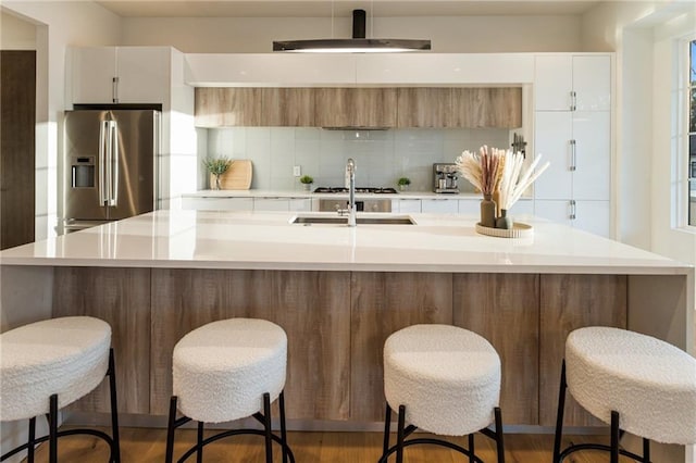1045 Shepherds Ln NE, Atlanta, GA 30324 - kitchen featuring stainless steel appliances, modern cabinets, decorative backsplash, and light countertops