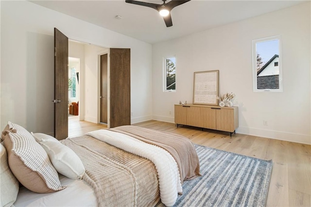 1045 Shepherds Ln NE, Atlanta, GA 30324 - bedroom with radiator heating unit, light wood-type flooring, baseboards, and ceiling fan