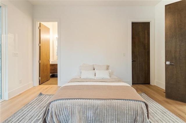 1045 Shepherds Ln NE, Atlanta, GA 30324 - bedroom with light wood-style floors and baseboards
