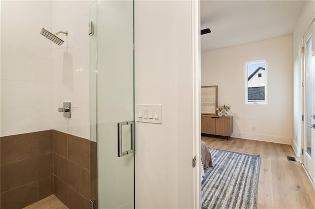 1045 Shepherds Ln NE, Atlanta, GA 30324 - full bath with baseboards, radiator, wood finished floors, and a shower stall