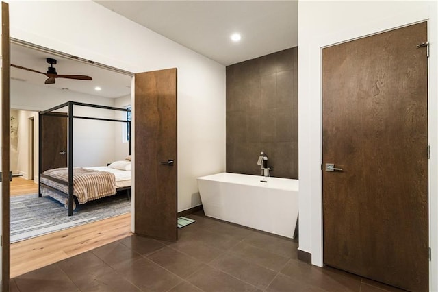 1045 Shepherds Ln NE, Atlanta, GA 30324 - ensuite bathroom featuring ceiling fan, recessed lighting, tile patterned floors, a soaking tub, and ensuite bath