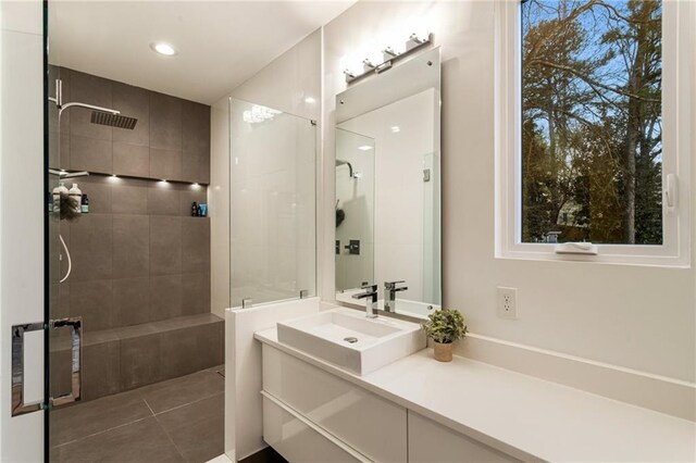 1045 Shepherds Ln NE, Atlanta, GA 30324 - bathroom with vanity, tile patterned floors, recessed lighting, and tiled shower