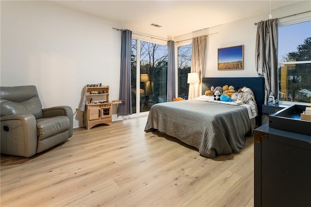 1045 Shepherds Ln NE, Atlanta, GA 30324 - bedroom featuring visible vents and light wood-style flooring