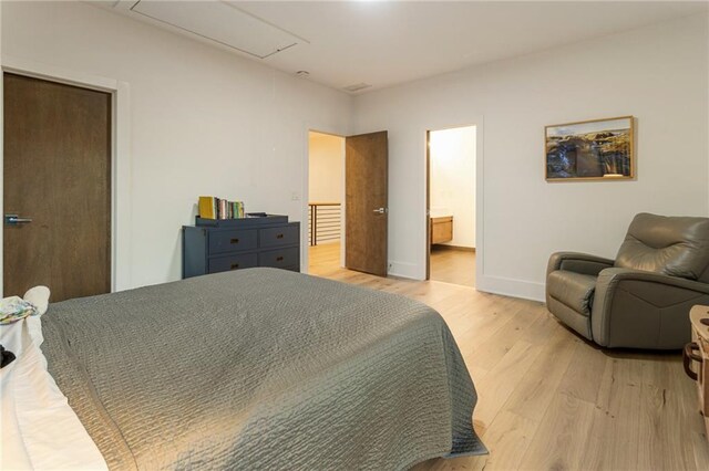 1045 Shepherds Ln NE, Atlanta, GA 30324 - bedroom featuring light wood finished floors, attic access, and baseboards