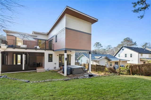 1045 Shepherds Ln NE, Atlanta, GA 30324 - rear view of property featuring a balcony, a yard, fence, and a hot tub