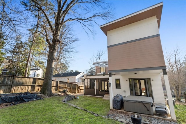 1045 Shepherds Ln NE, Atlanta, GA 30324 - rear view of property featuring a fenced backyard, a yard, french doors, a balcony, and a hot tub