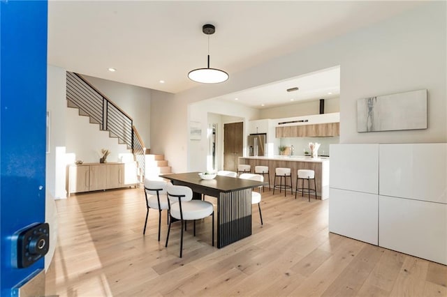 1045 Shepherds Ln NE, Atlanta, GA 30324 - dining space featuring stairs, recessed lighting, and light wood-style floors