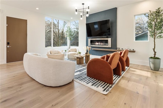 1045 Shepherds Ln NE, Atlanta, GA 30324 - living area featuring a wealth of natural light, an inviting chandelier, wood finished floors, and recessed lighting