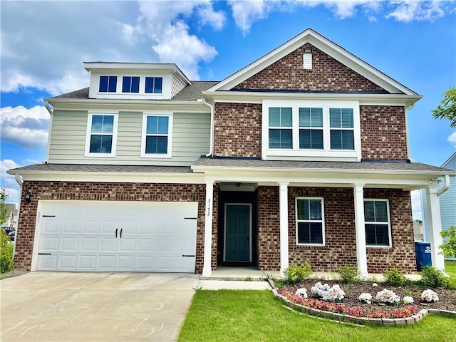3172 Lowell Rd, Bethlehem, GA 30620 - view of front facade featuring concrete driveway, a garage, covered porch, and brick siding