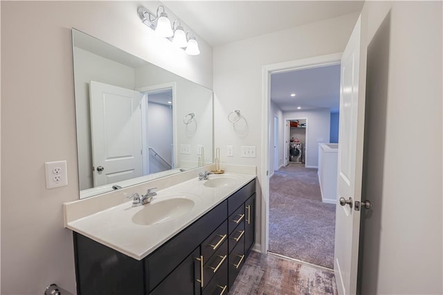 3172 Lowell Rd, Bethlehem, GA 30620 - bathroom featuring double vanity and washer / dryer