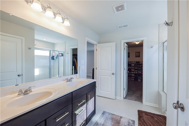 3172 Lowell Rd, Bethlehem, GA 30620 - full bathroom featuring a shower stall, double vanity, tile patterned flooring, and a spacious closet