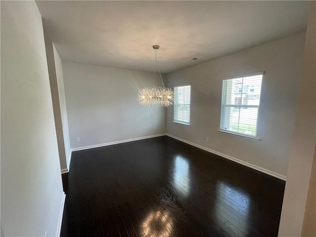 3172 Lowell Rd, Bethlehem, GA 30620 - empty room featuring dark wood-type flooring and a chandelier