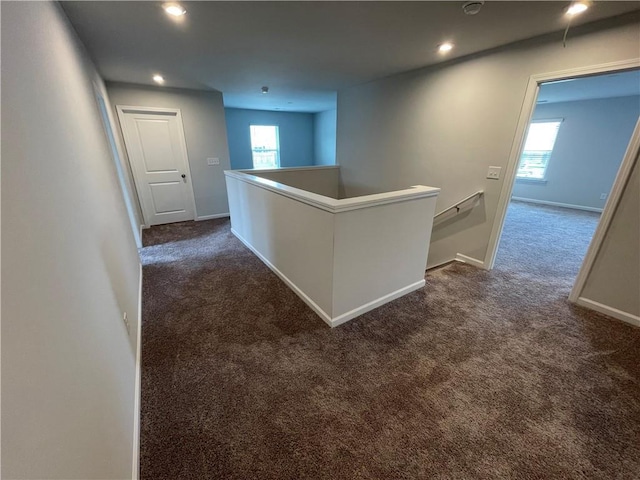 3172 Lowell Rd, Bethlehem, GA 30620 - hallway featuring an upstairs landing, dark carpet, plenty of natural light, and recessed lighting