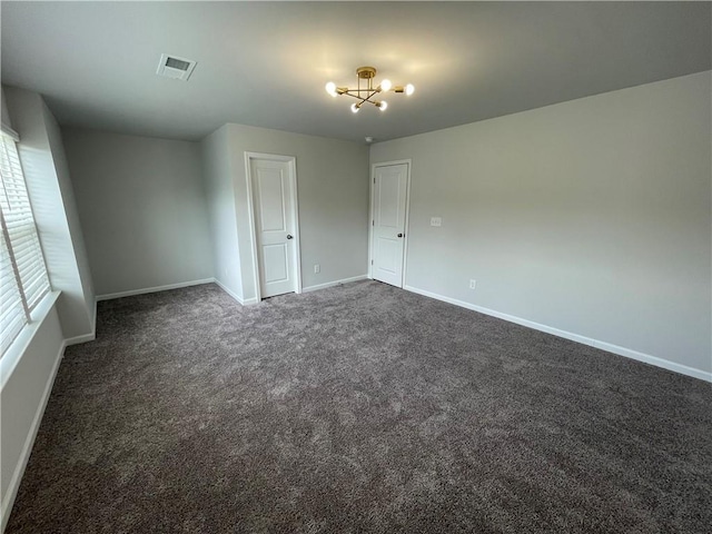 3172 Lowell Rd, Bethlehem, GA 30620 - unfurnished room with dark carpet and a chandelier