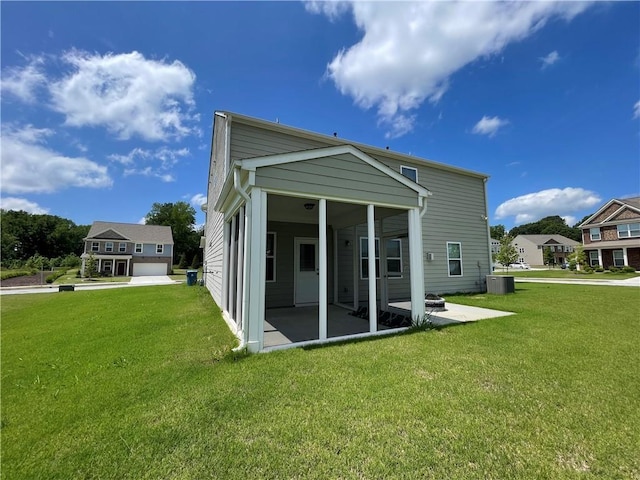 3172 Lowell Rd, Bethlehem, GA 30620 - back of house featuring a sunroom, a patio area, and a yard