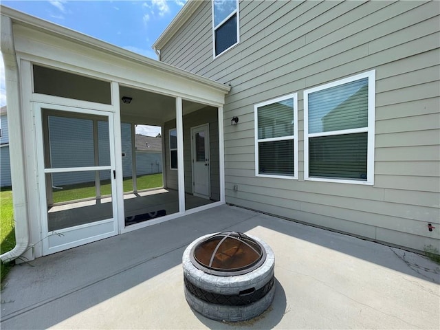 3172 Lowell Rd, Bethlehem, GA 30620 - view of patio / terrace with an outdoor fire pit and a sunroom