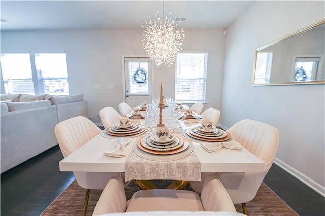 3172 Lowell Rd, Bethlehem, GA 30620 - dining room featuring healthy amount of natural light, a chandelier, and dark wood-style flooring