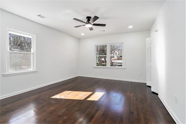 unfurnished room featuring ceiling fan and dark hardwood / wood-style floors