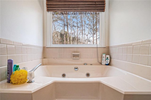 full bath featuring a tub with jets