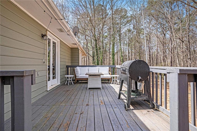 wooden deck featuring outdoor lounge area