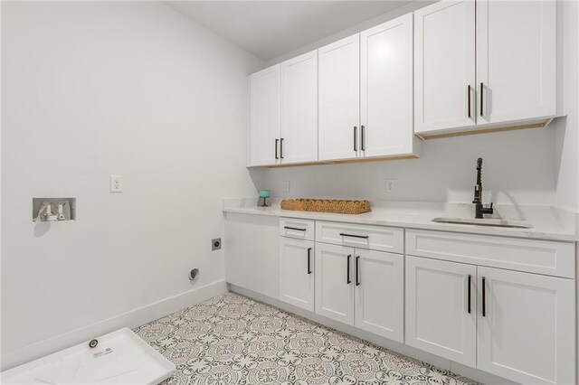 5808 Swinging Gate Rd, Gainesville, GA 30506 - laundry area with a sink, baseboards, hookup for an electric dryer, and cabinet space