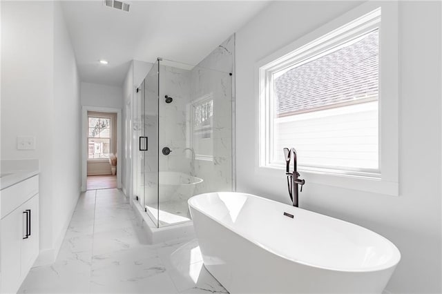 5808 Swinging Gate Rd, Gainesville, GA 30506 - full bathroom featuring vanity, a marble finish shower, marble finish floor, visible vents, and a soaking tub