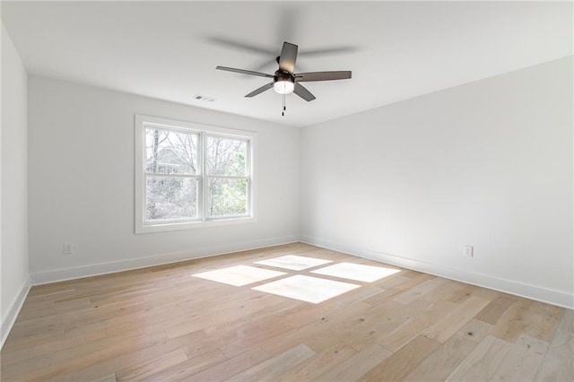 5808 Swinging Gate Rd, Gainesville, GA 30506 - unfurnished room featuring light wood-style floors, baseboards, a ceiling fan, and visible vents