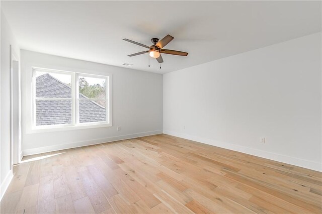 5808 Swinging Gate Rd, Gainesville, GA 30506 - unfurnished room featuring baseboards, a ceiling fan, light wood finished floors, and visible vents