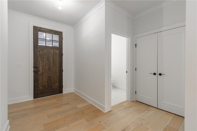5808 Swinging Gate Rd, Gainesville, GA 30506 - foyer entrance with baseboards, ornamental molding, and light wood-style flooring