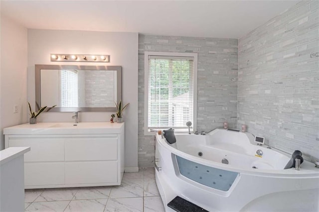 4408 Shiloh Trl, Powder Springs, GA 30127 - bathroom featuring vanity, a whirlpool tub, and marble look tile flooring
