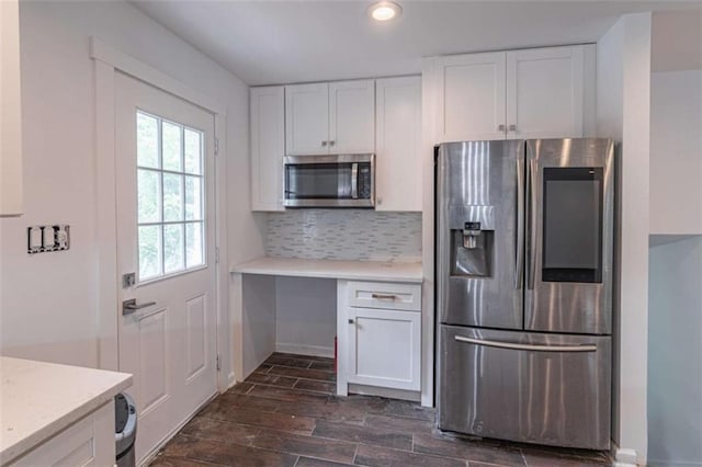 4408 Shiloh Trl, Powder Springs, GA 30127 - kitchen featuring appliances with stainless steel finishes, white cabinets, light countertops, tasteful backsplash, and recessed lighting