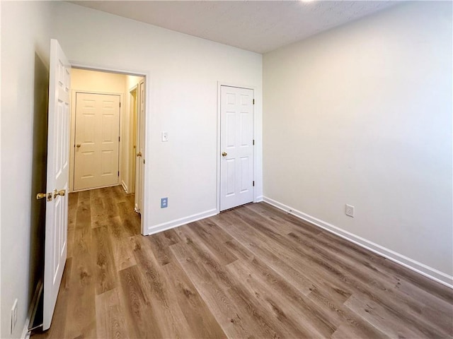 unfurnished room featuring hardwood / wood-style floors