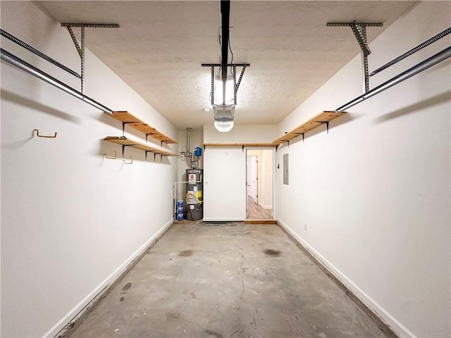 garage featuring a garage door opener and gas water heater