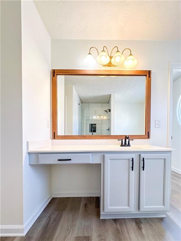 bathroom with vanity, hardwood / wood-style flooring, and an enclosed shower