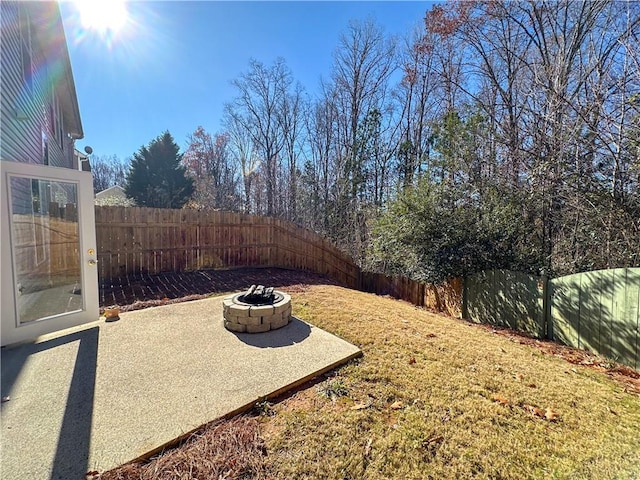 view of yard featuring an outdoor fire pit and a patio area