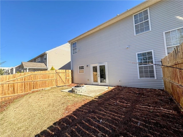 back of house with french doors and a patio