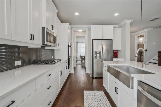1055 Peyton View Ct, Alpharetta, GA 30004 - kitchen featuring stainless steel appliances, a sink, light stone countertops, white cabinets, and tasteful backsplash