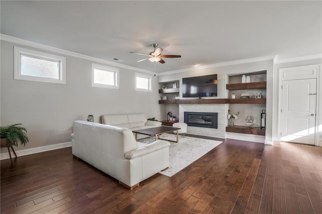 1055 Peyton View Ct, Alpharetta, GA 30004 - living area with crown molding, a ceiling fan, a fireplace, dark wood finished floors, and baseboards