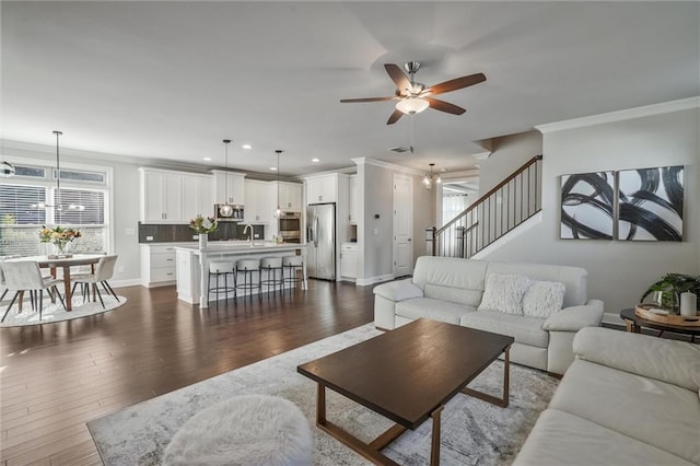 1055 Peyton View Ct, Alpharetta, GA 30004 - living area featuring a ceiling fan, crown molding, recessed lighting, dark wood-style flooring, and stairway