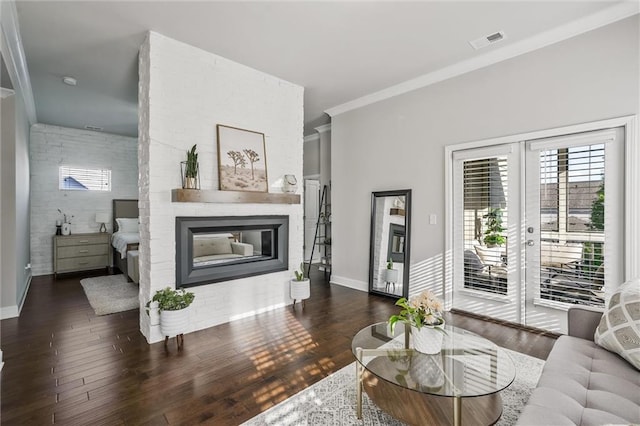 1055 Peyton View Ct, Alpharetta, GA 30004 - living area featuring a glass covered fireplace, ornamental molding, wood finished floors, and baseboards