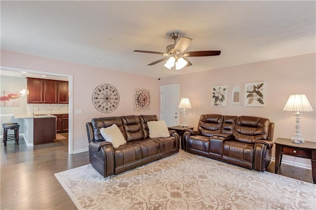 3370 Battlement Cir, Loganville, GA 30052 - living area featuring a ceiling fan and wood finished floors