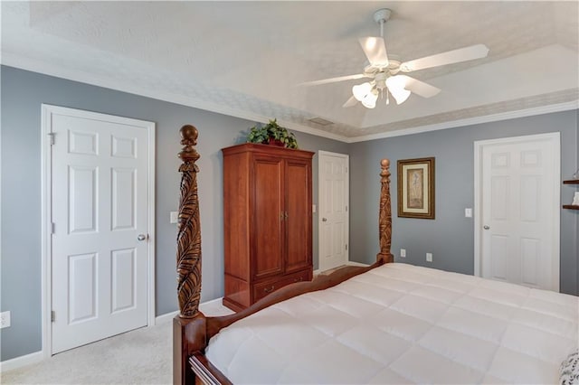 3370 Battlement Cir, Loganville, GA 30052 - bedroom with light colored carpet, a ceiling fan, a raised ceiling, and crown molding